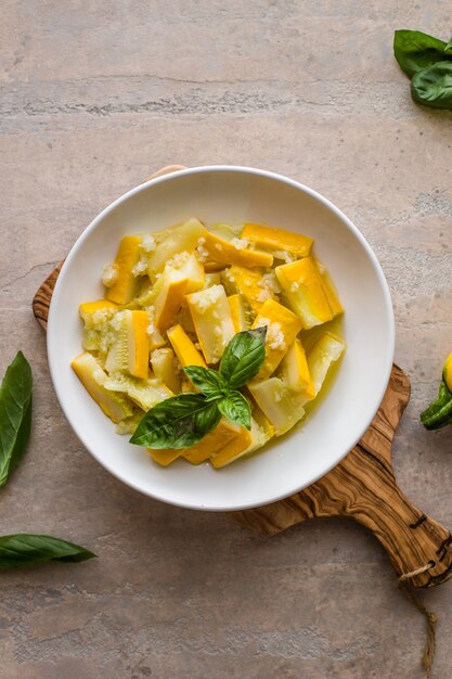 Premium Photo | Healthy boiled zucchini with garlic and basil.