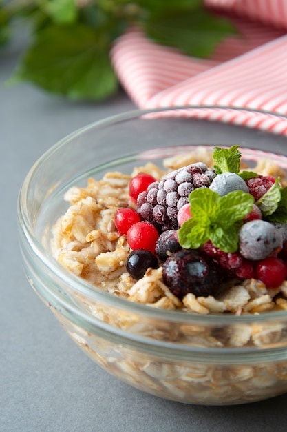 Premium Photo | Healthy breakfast with oats, berries and mint. oat