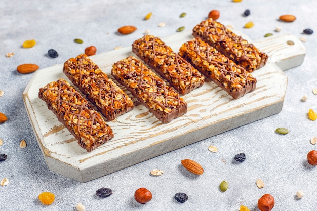 Healthy delicios granola bars with chocolate,muesli bars with nuts and dry fruits,top view Free Photo