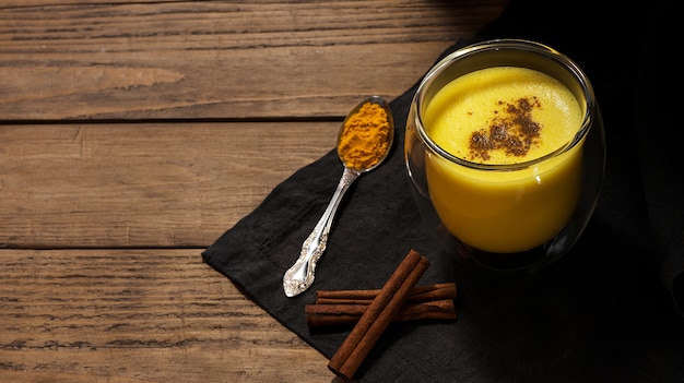 Premium Photo | Healthy drink with milk, turmeric, cinnamon, pepper ...