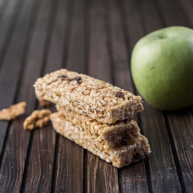 Healthy energy bars and apple Free Photo