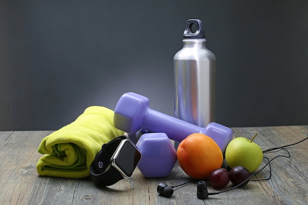 Free Photo | Healthy lifestyle dumbbell smart watch and fruit