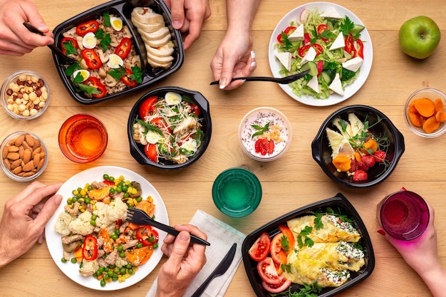 Premium Photo | Healthy lunch time at office workplace. four people ...