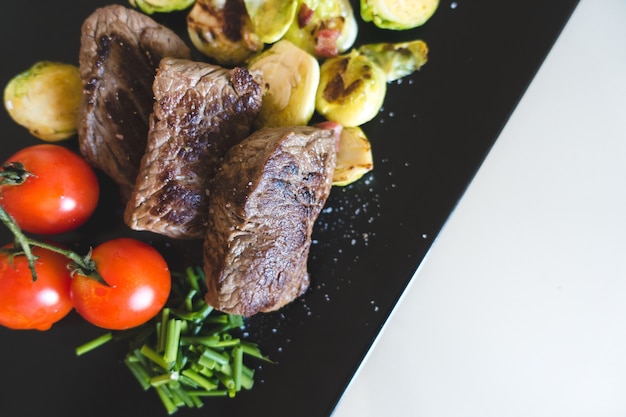 Healthy paleo grilled beef steak with vegetables Free Photo