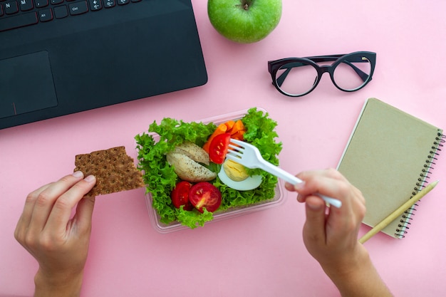 Premium Photo | Healthy snack from lunch box at workplace during lunch ...