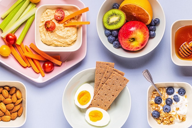 Premium Photo | Healthy snack on a pastel background, top view.