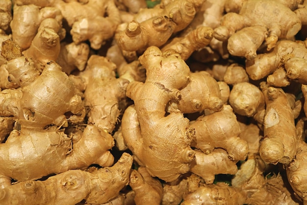 Premium Photo | Heap of fresh ginger rhizomes for sale on the market