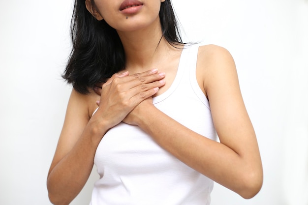 Heart pain. beautiful asian woman suffering from pain in chest Premium Photo