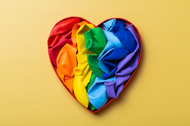 Premium Photo Heart Shaped Rainbow Lgbtq Flag Against Yellow Background Pride Month 2291