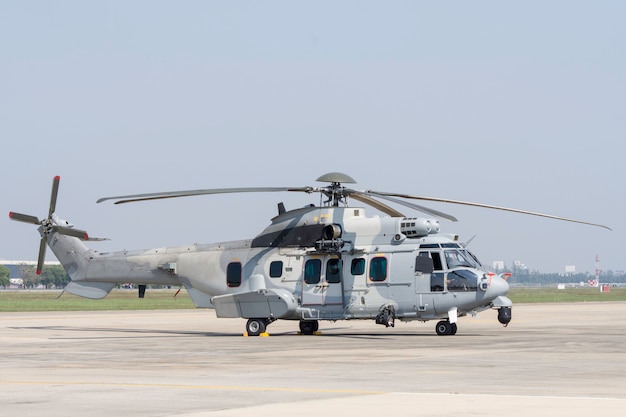 Premium Photo | Helicopter black hawk hovering over helipad with ...