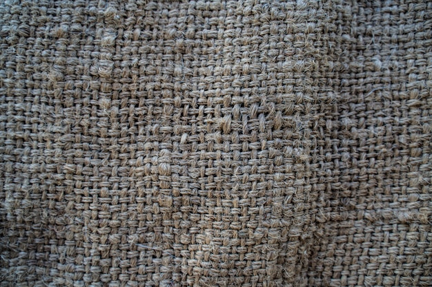 The hessian sackcloth woven texture pattern background in light cream yellow beige color Premium Photo