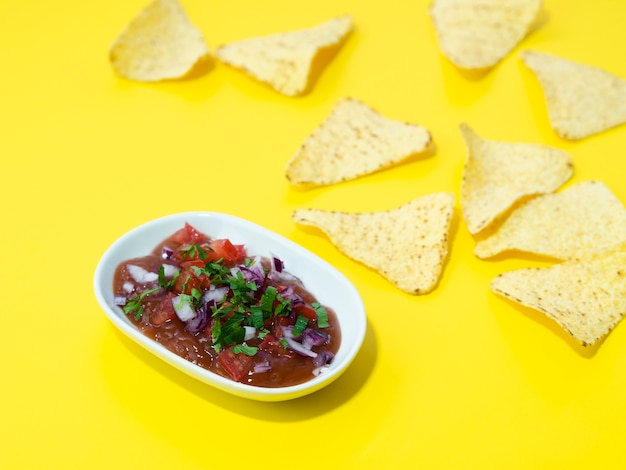 High angle arrangement with tortilla chips and sauce Free Photo