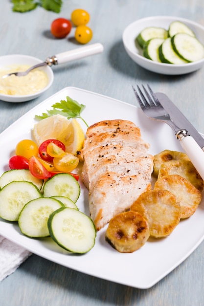High angle of chicken breast with assortment of vegetables Free Photo