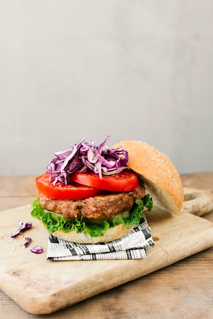 Free Photo | High angle close-up of burger on wooden board