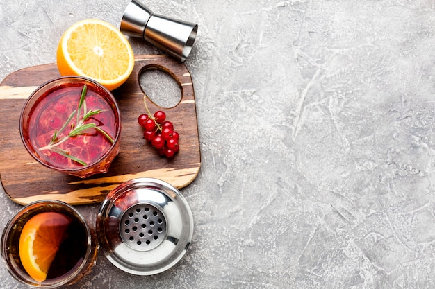 Free Photo | High angle cranberry vodka on cutting board with copy-space