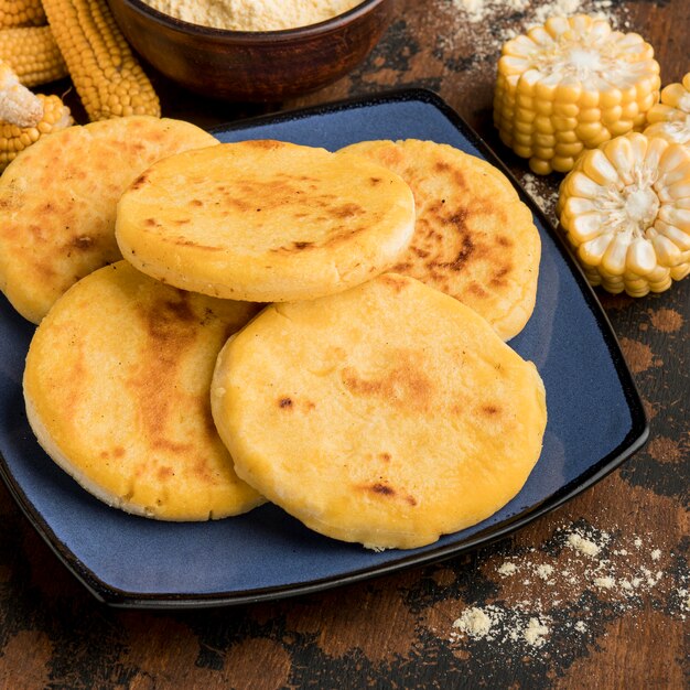 Premium Photo | High angle delicious arepas on plate