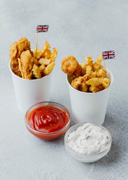 Free Photo | High angle of fish and chips in paper cups with great