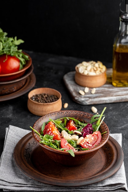 Fresh salad in brown bowl from a high angle