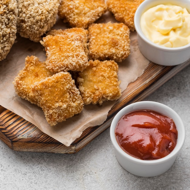 Free Photo | High angle of fried chicken nuggets with two different sauces