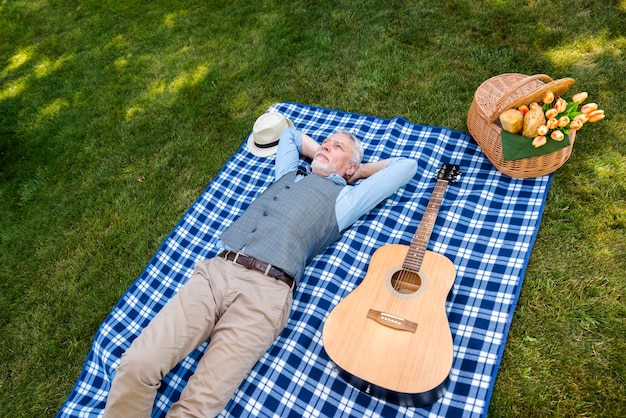 High angle man laying on a blanket Free Photo