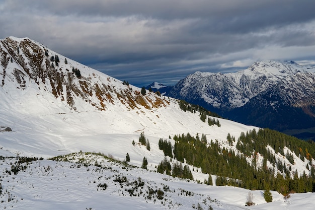 Free Photo High Angle Shot Of The Alpine Mountain Range Under The Cloudy Sky