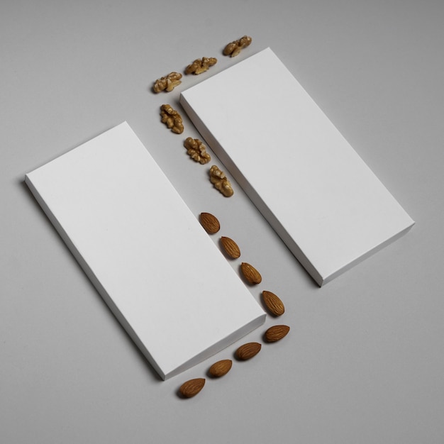 Free Photo | High angle of two blank chocolate bars packages with nuts