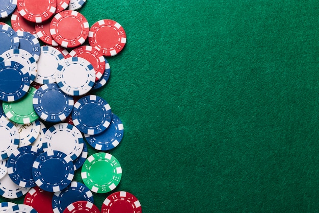 Premium Photo High Angle View Of Poker Chips On Green Table