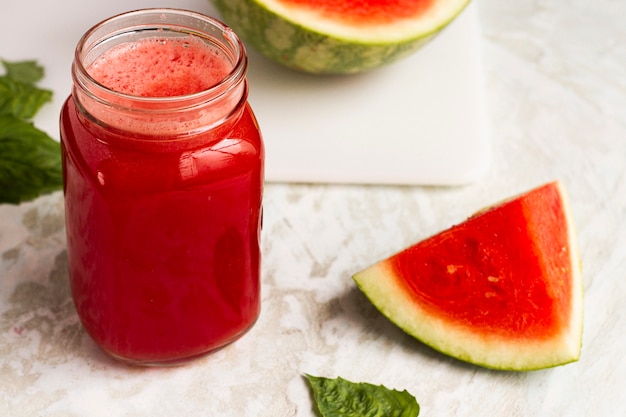 Free Photo | High angle watermelon juice in glass jar