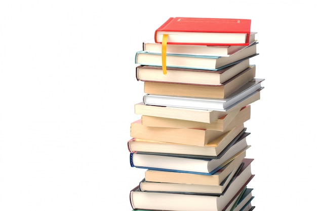 Premium Photo High Pile Of Different Books Isolated Red Book With Yellow Bookmark On Top Of The Pile Background