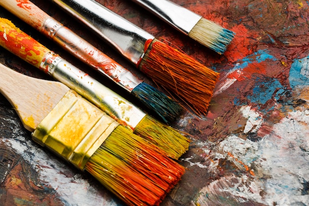 Free Photo | High view dirty paint brushes