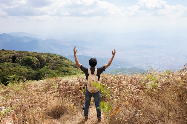 Free Photo | Hiker raising arms