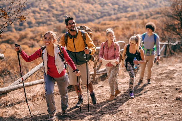 Premium Photo | Hikers Climbing The Hill.