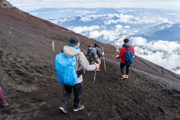 Premium Photo | Hikers climbing on yoshida trail on fuji mountain in ...