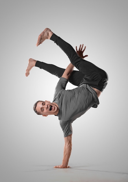 Premium Photo | Hip hop guy performs breakdance acrobatic elements. man ...