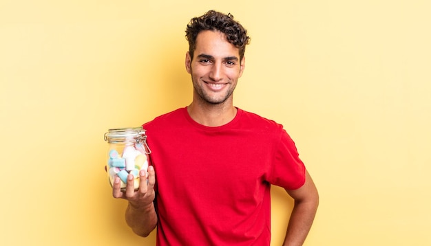 Premium Photo Hispanic Handsome Man Smiling Happily With A Hand On