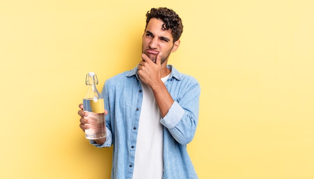 Premium Photo | Hispanic handsome man thinking, feeling doubtful and ...