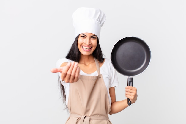Premium Photo Hispanic Pretty Chef Woman Holding A Pan