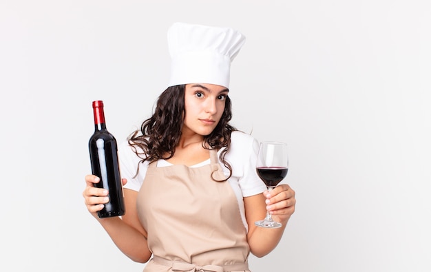Premium Photo Hispanic Pretty Chef Woman With A Bottle Of Wine