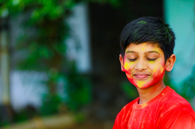 Premium Photo | Holi celebrations -indian little boy playing holi and