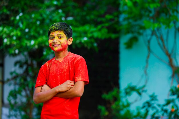 Premium Photo | Holi celebrations -indian little boy playing holi and