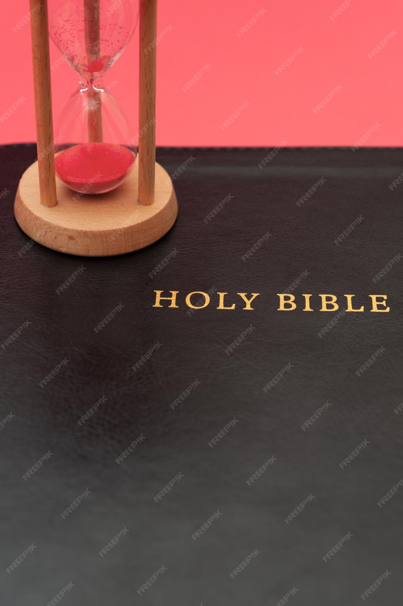 premium-photo-holy-bible-the-word-of-god-with-hourglass