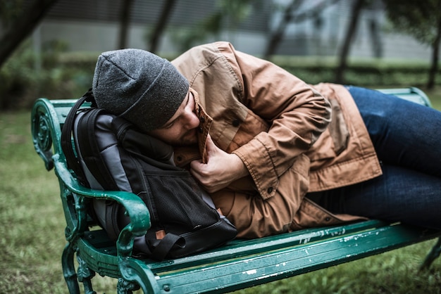 Premium Photo Homeless People Sleeping On Bench In The Park