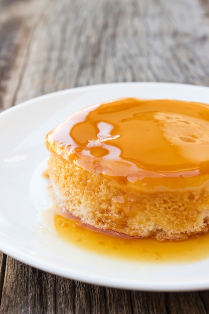 Premium Photo | Homemade caramel custard cake on white plate. french ...