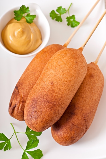 Premium Photo | Homemade corn dogs with sauces