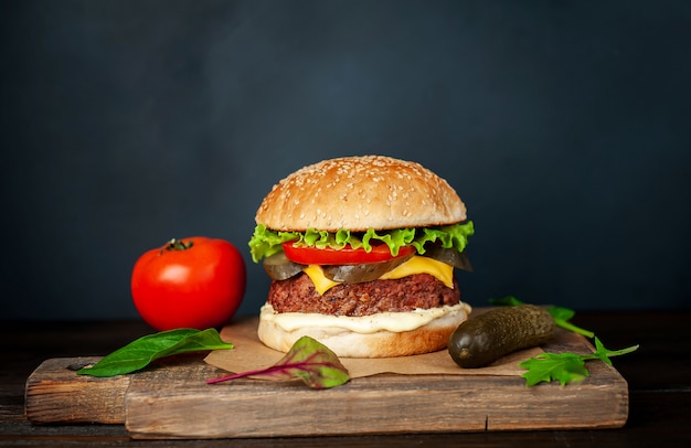 Premium Photo | Homemade hamburger with lettuce, tomato, cheese and ...