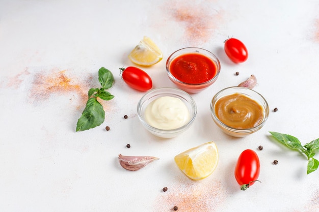 Homemade ketchup,mustard and mayonnaise sauce. Free Photo