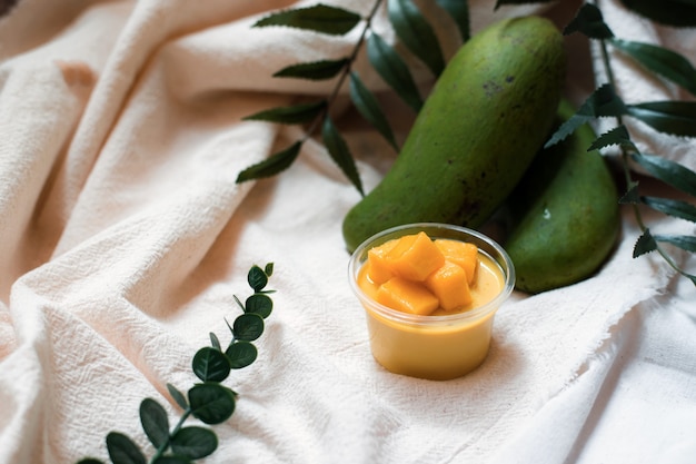 Premium Photo | Homemade mango pudding in plastic cup for take away