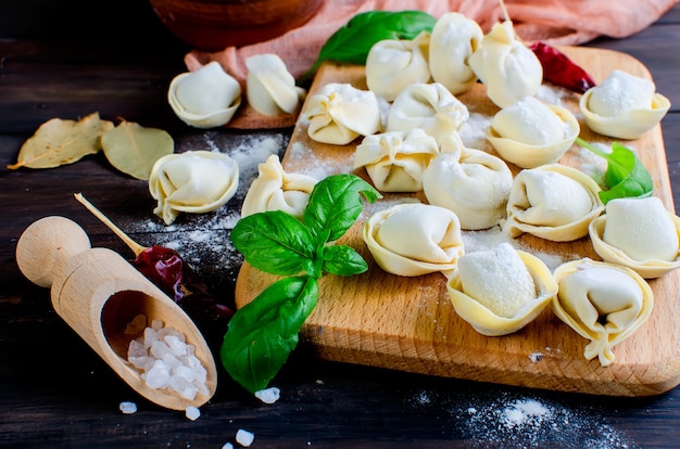 Premium Photo | Homemade meat dumplings on a dark