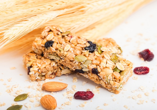 Premium Photo | Homemade organic granola cereal bar with nuts and dried ...