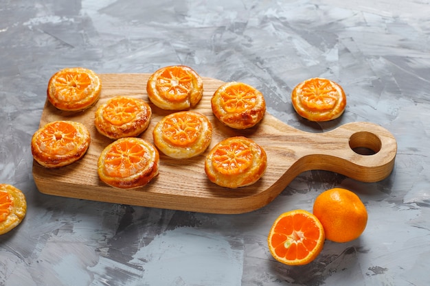 Free Photo | Homemade puff pastry with tangerine slices.